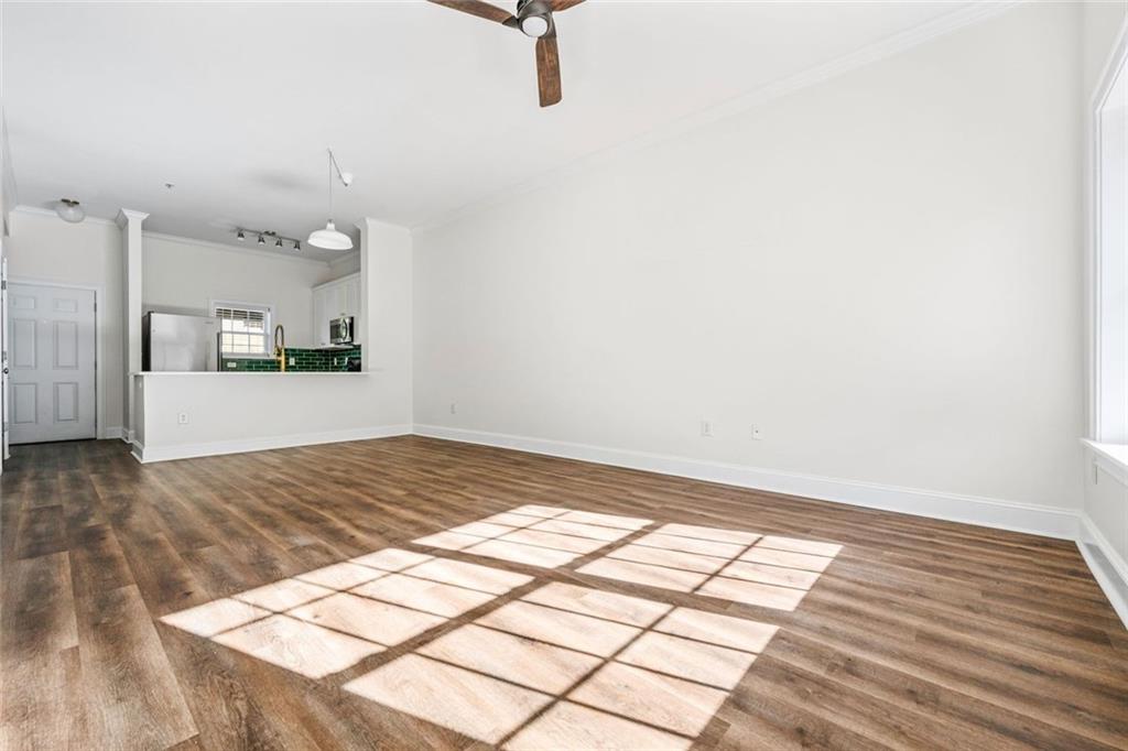 1635 Briarcliff Rd Road, Unit 8 Atlanta, GA 30306 - Photo 12 of 29 a view of empty room with wooden floor and window