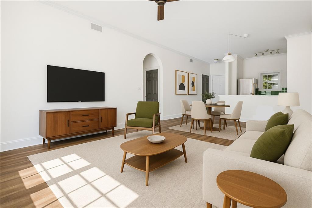 1635 Briarcliff Rd Road, Unit 8 Atlanta, GA 30306 - Photo 13 of 29 a living room with furniture and a flat screen tv