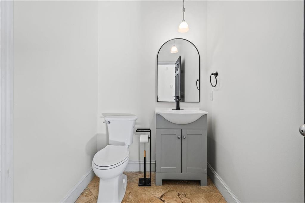 1635 Briarcliff Rd Road, Unit 8 Atlanta, GA 30306 - Photo 19 of 29 a bathroom with a toilet sink and mirror