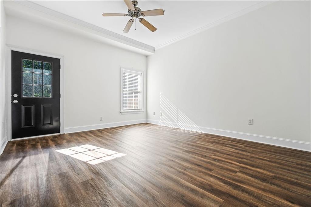 1635 Briarcliff Rd Road, Unit 8 Atlanta, GA 30306 - Photo 20 of 29 a view of empty room with wooden floor and fan
