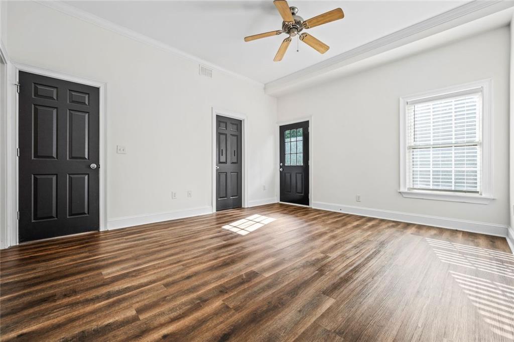 1635 Briarcliff Rd Road, Unit 8 Atlanta, GA 30306 - Photo 22 of 29 a view of an empty room with wooden floor and a window