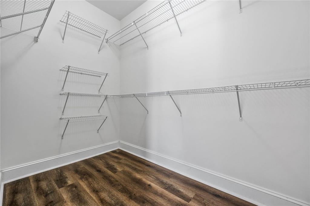 1635 Briarcliff Rd Road, Unit 8 Atlanta, GA 30306 - Photo 23 of 29 a view of a room with racks on the wall