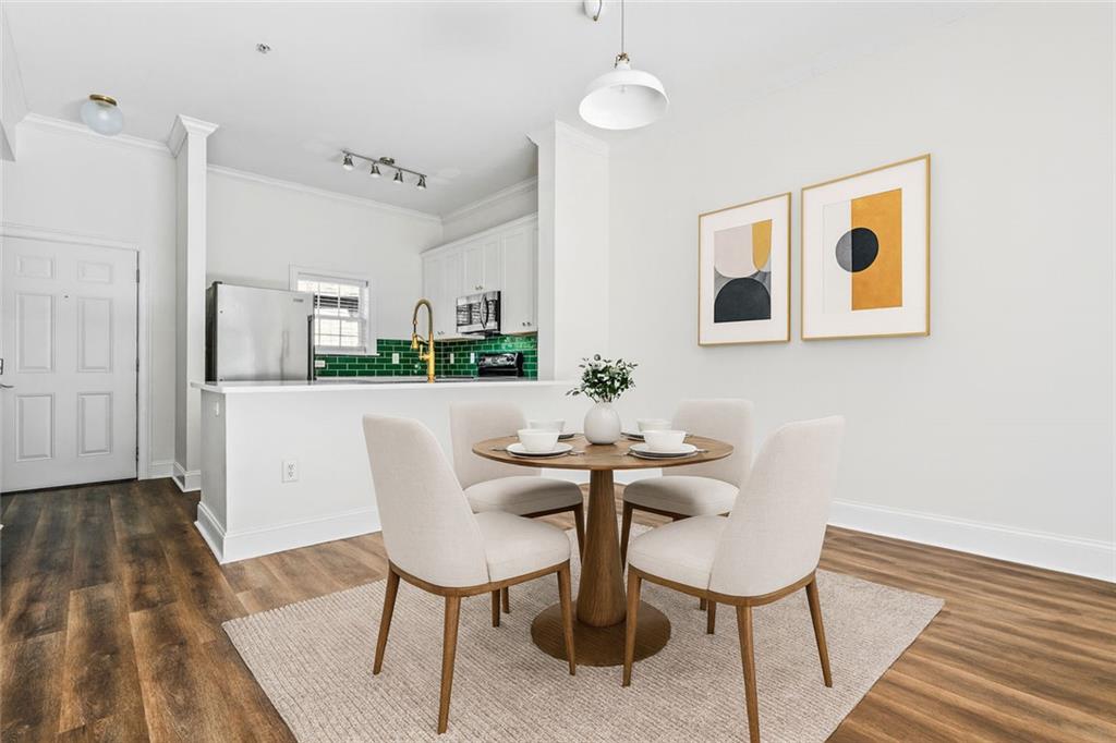 1635 Briarcliff Rd Road, Unit 8 Atlanta, GA 30306 - Photo 7 of 29 a view of a dining room with furniture and wooden floor