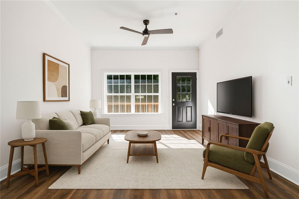 1635 Briarcliff Rd Road, Unit 8 Atlanta, GA 30306 - Photo 10 of 29 a living room with furniture and a flat screen tv