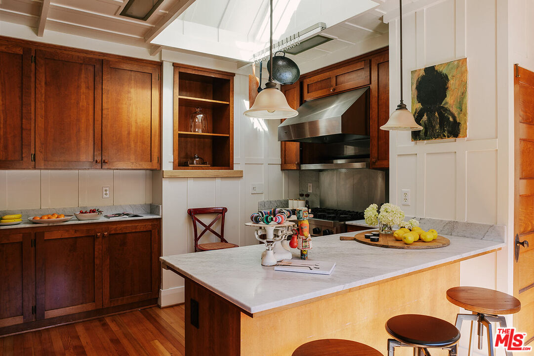 1954 Pinehurst Road Los Angeles, CA 90068 - Photo 17 of 42 a kitchen with a sink cabinets and appliances