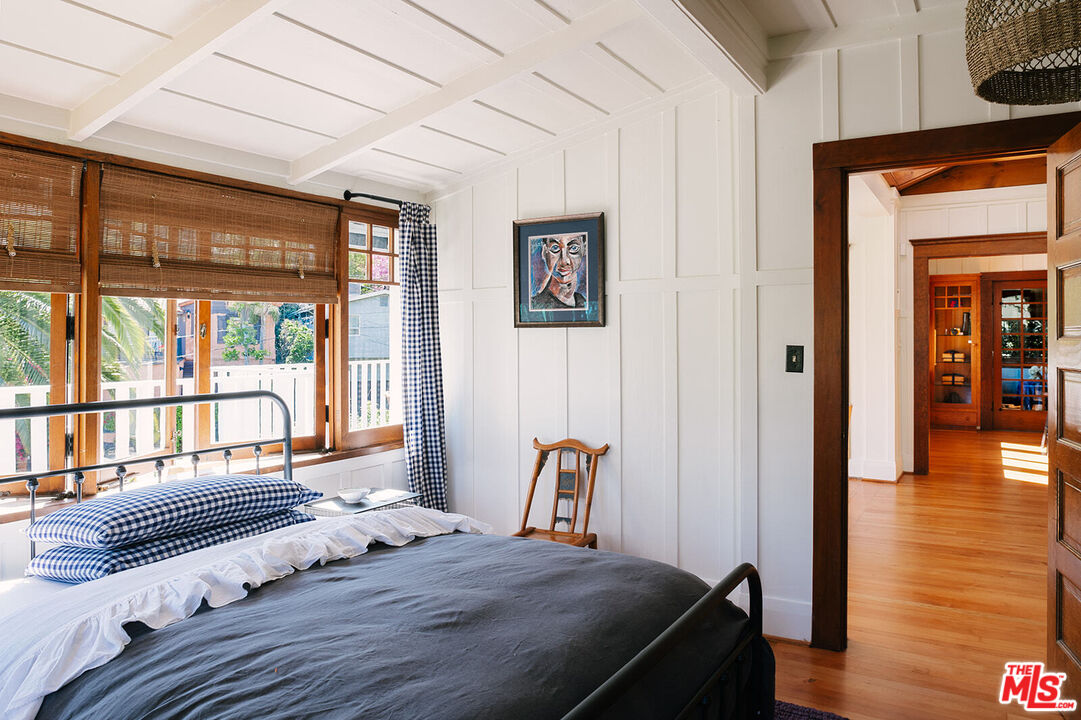 1954 Pinehurst Road Los Angeles, CA 90068 - Photo 23 of 42 a bedroom with a bed and wooden floor