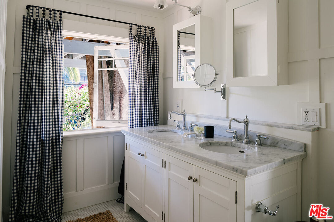 1954 Pinehurst Road Los Angeles, CA 90068 - Photo 29 of 42 a bathroom with a sink and a mirror