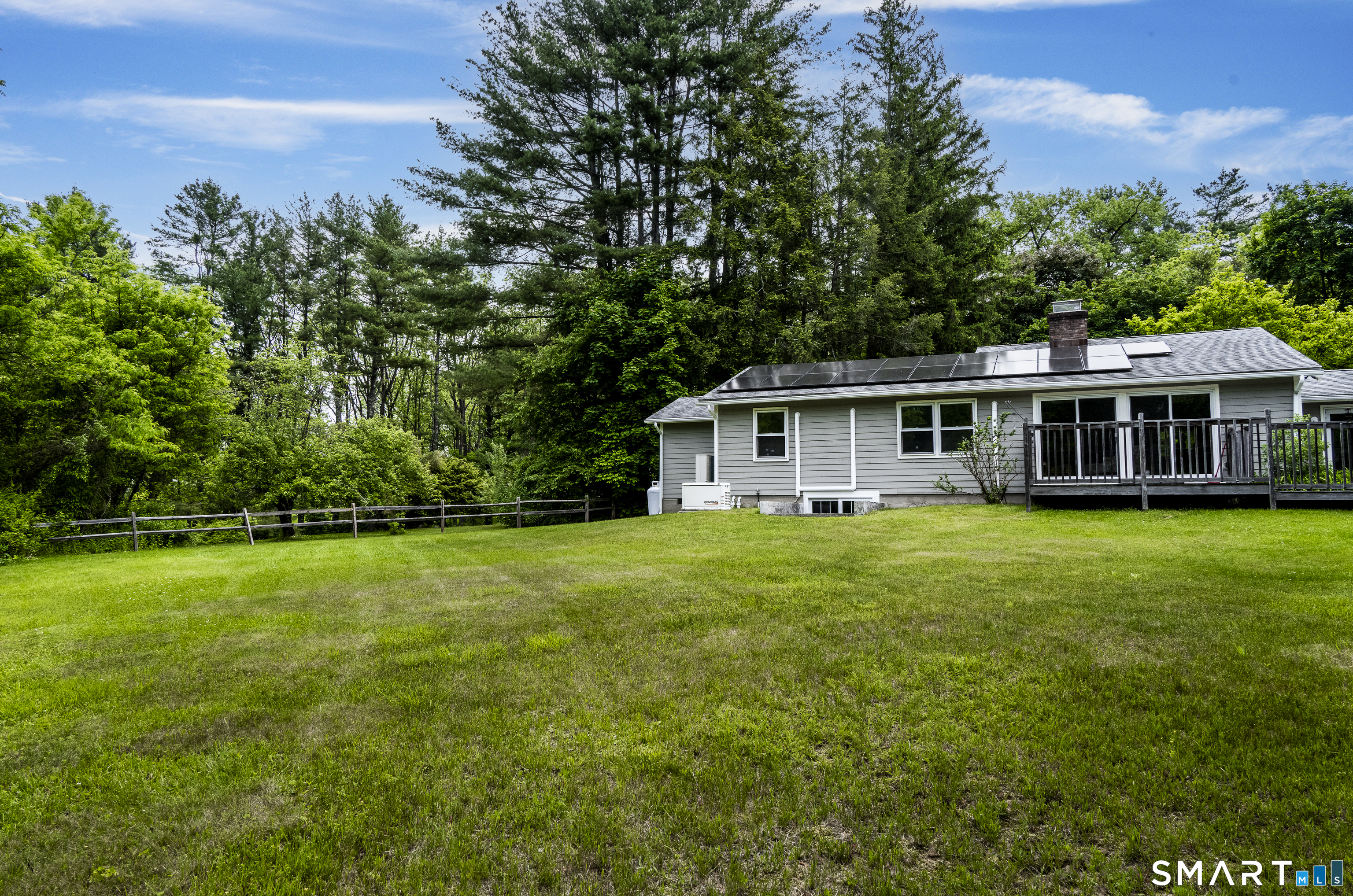 7 Chimney Rock Road Kent, CT 06757 - Photo 32 of 35 a front view of a house with a yard table and chairs