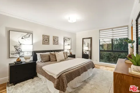 a en suite bathroom with a granite countertop sink