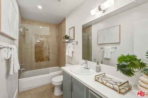 a front view of a multi story building with yard