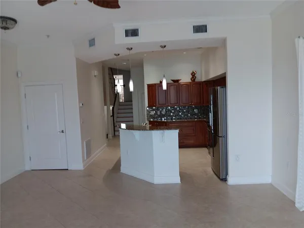 a view of kitchen cabinets and appliances