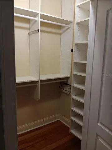 a bathroom with a granite countertop sink and mirror