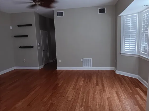 a view of a pool in the backyard of a house
