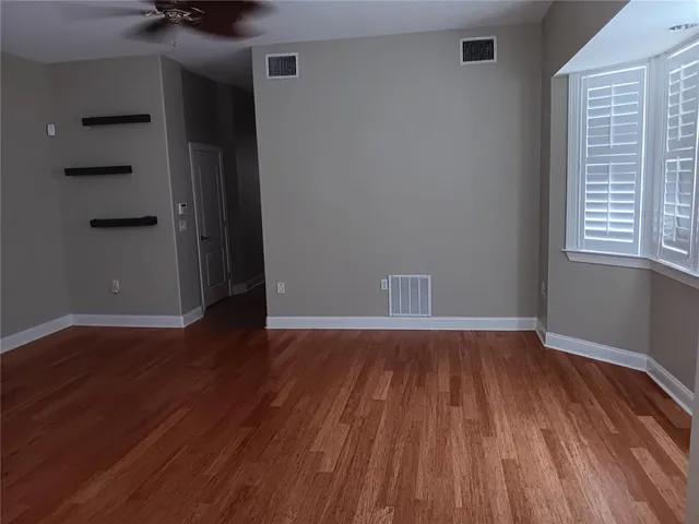 a view of a pool in the backyard of a house