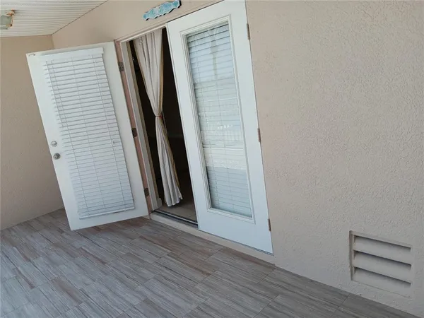 an empty room with wooden floor