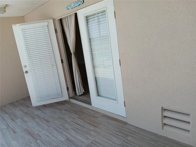 an empty room with wooden floor