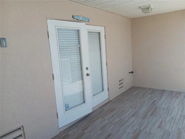 a view of bathroom with wooden floor