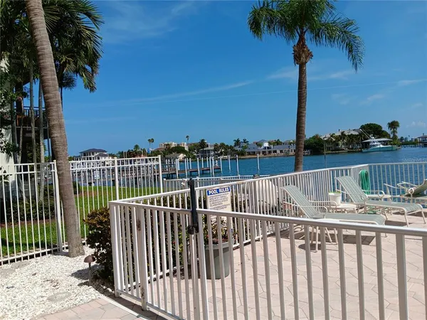 a view of roof deck with lake view and ocean view