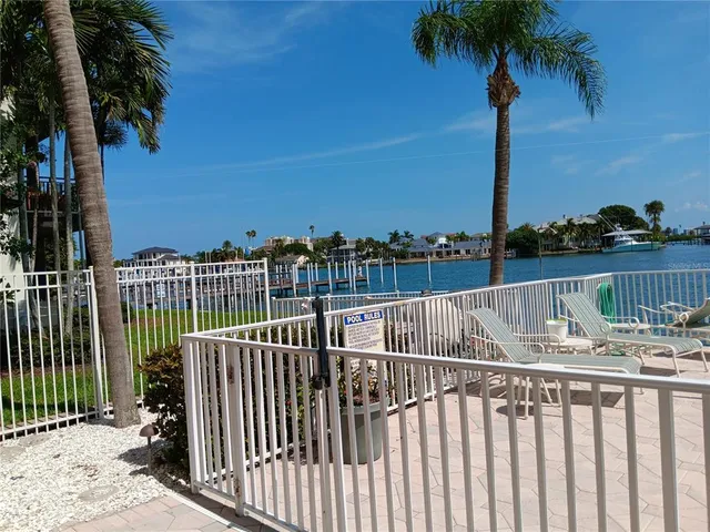 a view of roof deck with lake view and ocean view