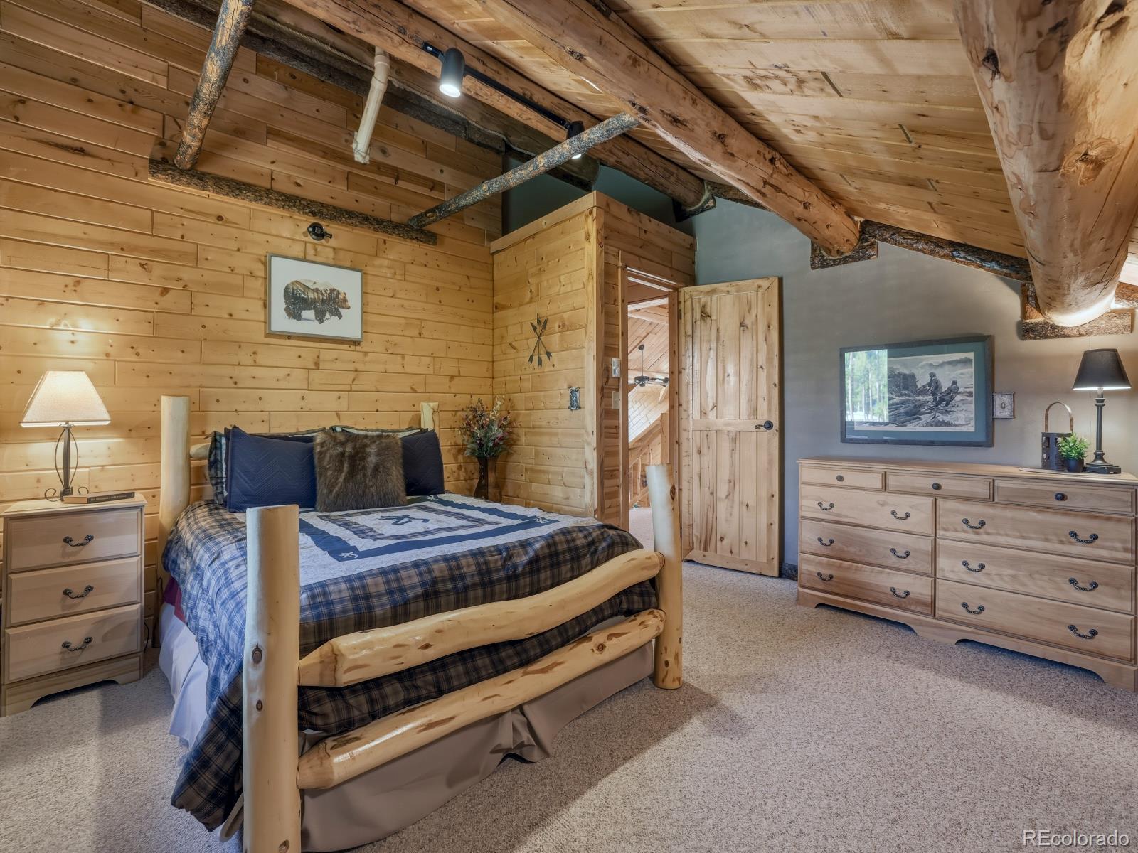 341 Anderson Road Walden, CO 80480 - Photo 35 of 50 a bedroom with a bed and a dresser