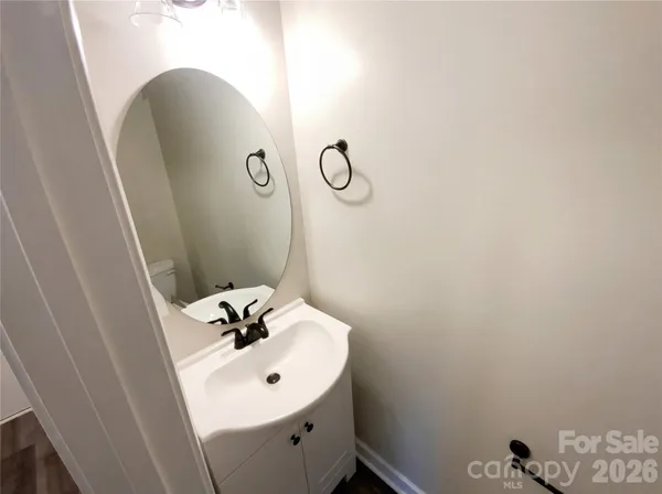a bathroom with a sink and mirror
