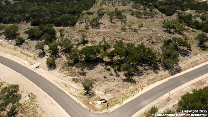 Tbc Bell Canyon Way Bulverde, TX 78163 - Photo 2 of 8 a view of a backyard of white house