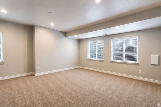 896 Cres Drive South Mapleton, UT 84664 - Photo 26 of 32 Carpeted room featuring recessed lighting, multiple windows with blinds, neutral wall paint, and white baseboards