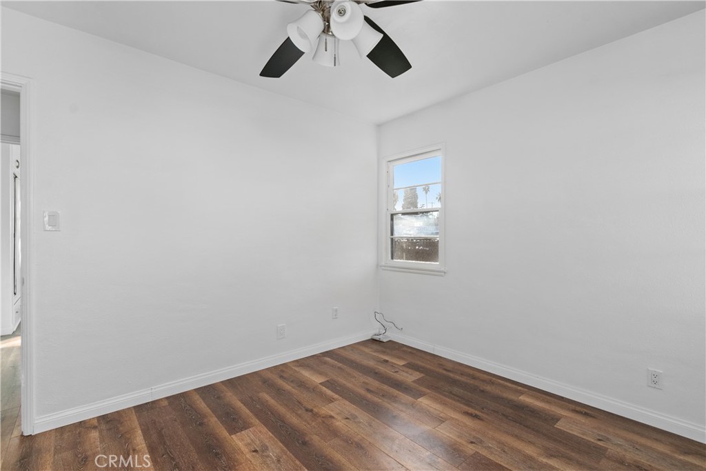 735 Michigan Avenue Beaumont, CA 92223 - Photo 12 of 19 a view of empty room with wooden floor
