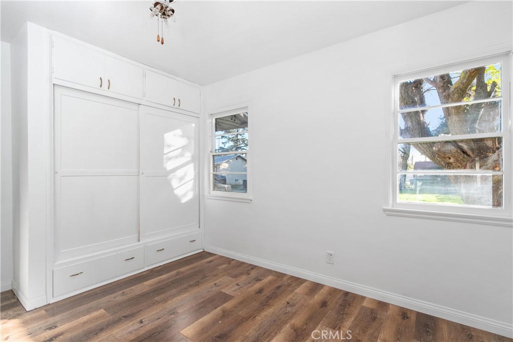 735 Michigan Avenue Beaumont, CA 92223 - Photo 17 of 19 a view of empty room with window and wooden floor