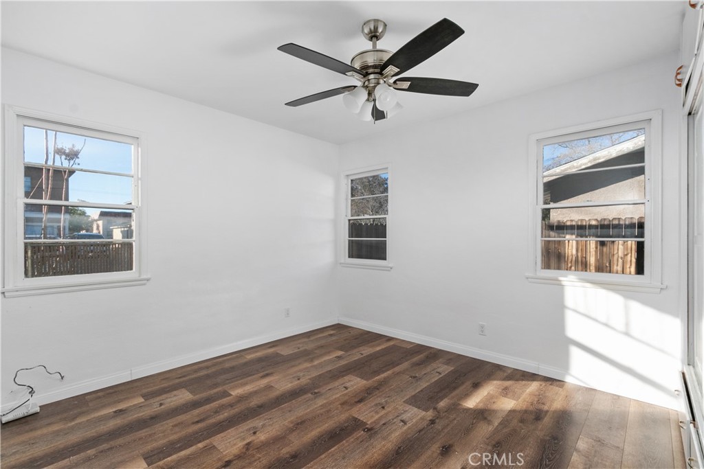 735 Michigan Avenue Beaumont, CA 92223 - Photo 9 of 19 a view of empty room with wooden floor