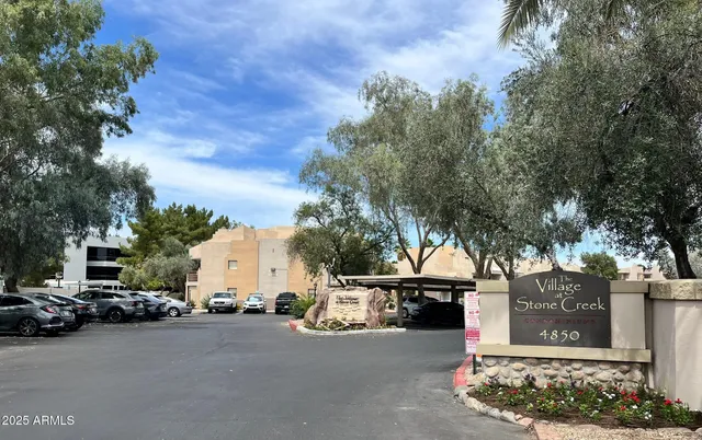 a view of a car park in front of house