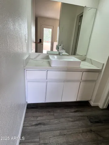 a bathroom with a sink and a mirror