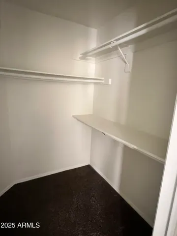 a view of an empty walk in closet