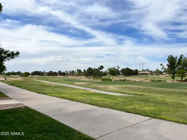 a view of building with outdoor space and lakeside