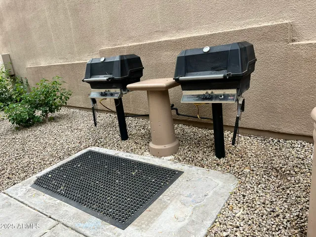 a view of barbeque area with seating area