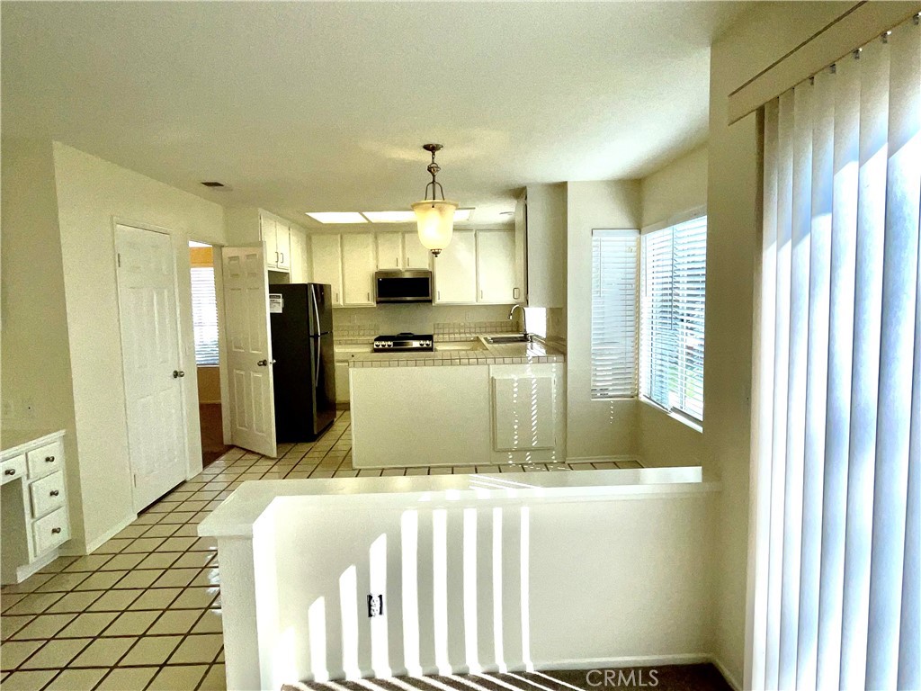 28182 Rancho Azul Laguna Niguel, CA 92677 - Photo 18 of 39 a kitchen with stainless steel appliances granite countertop a refrigerator a sink and a dishwasher