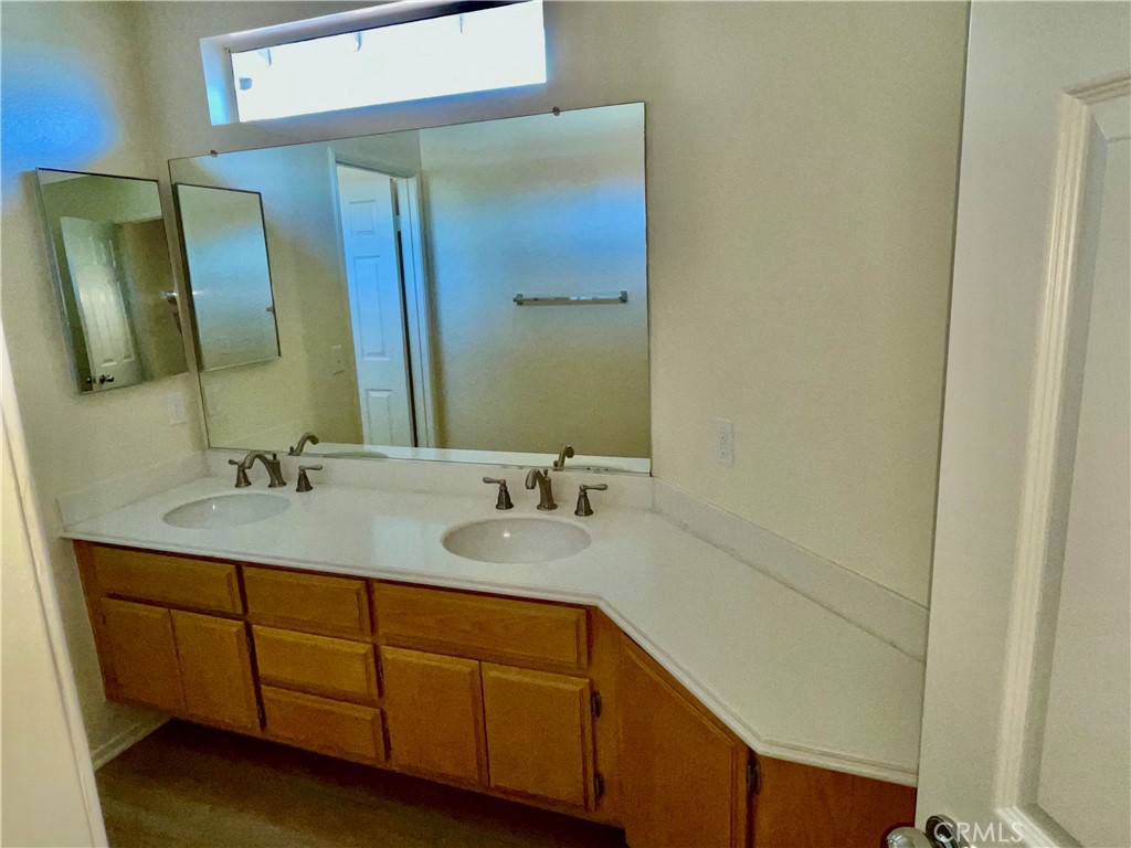 28182 Rancho Azul Laguna Niguel, CA 92677 - Photo 28 of 39 a bathroom with a double vanity sink and a mirror