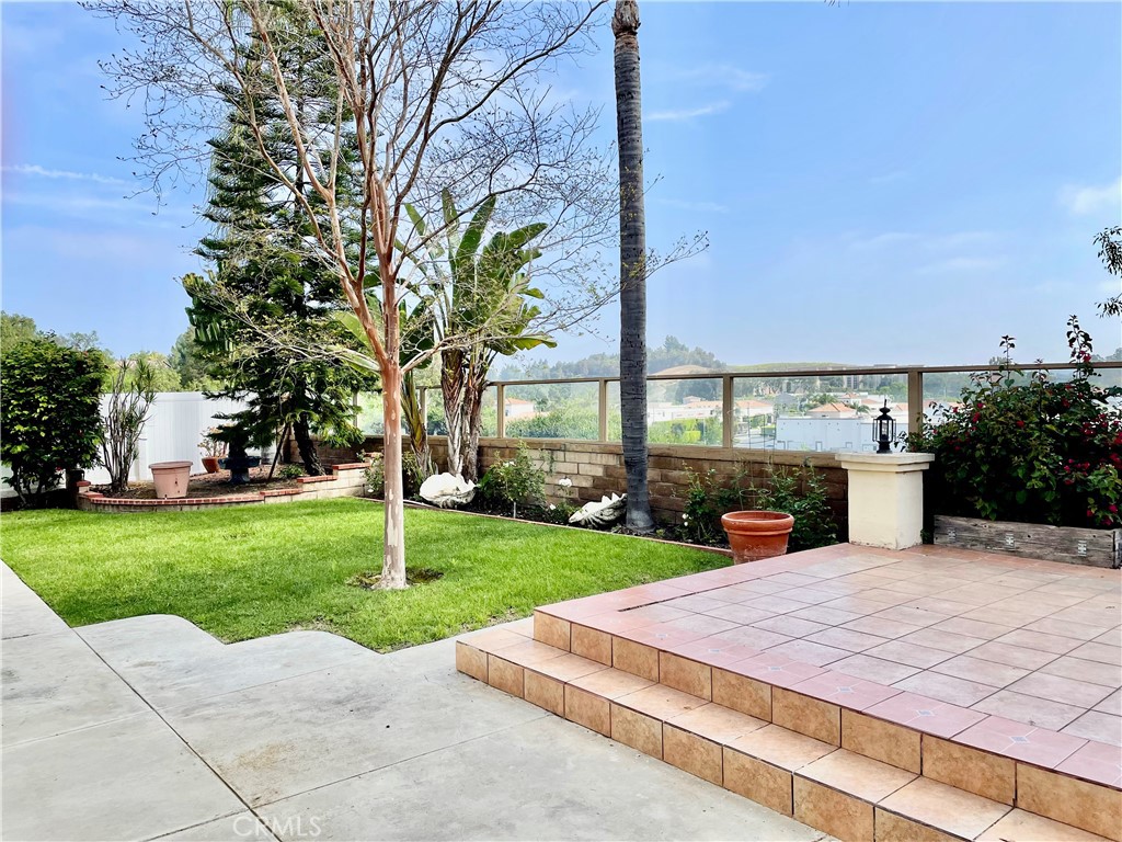 28182 Rancho Azul Laguna Niguel, CA 92677 - Photo 7 of 39 a view of a patio with a table and chairs under an umbrella