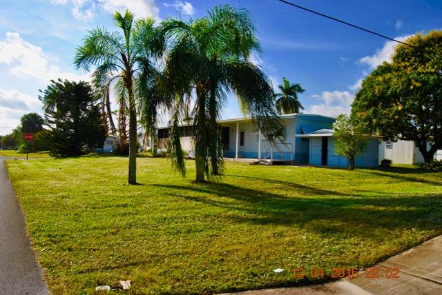 7039 Southeast Ridgeway Terrace Hobe Sound, FL 33455 - Photo 5 of 38 Rear View