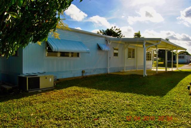 7039 Southeast Ridgeway Terrace Hobe Sound, FL 33455 - Photo 8 of 38 Rear West Side