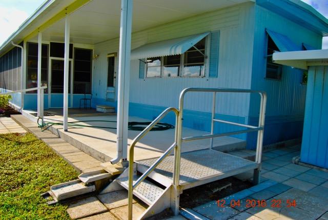 7039 Southeast Ridgeway Terrace Hobe Sound, FL 33455 - Photo 9 of 38 East Side Patio
