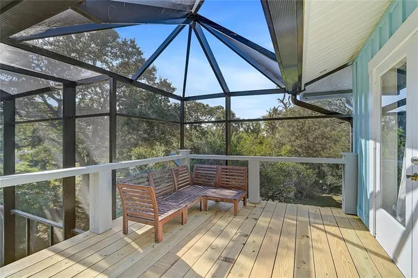 a view of roof deck with seating area