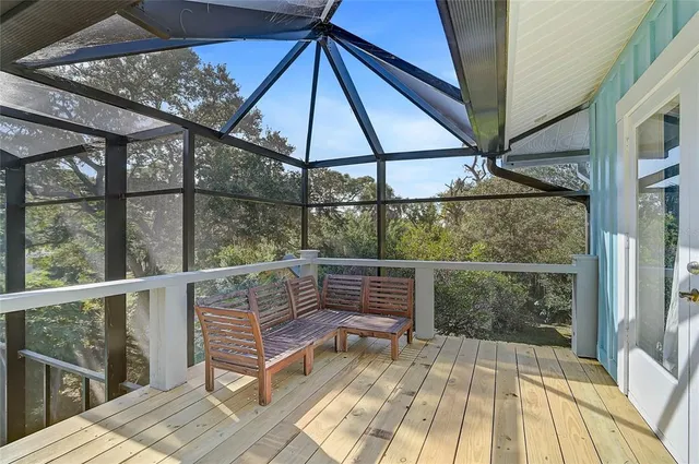 a view of roof deck with seating area