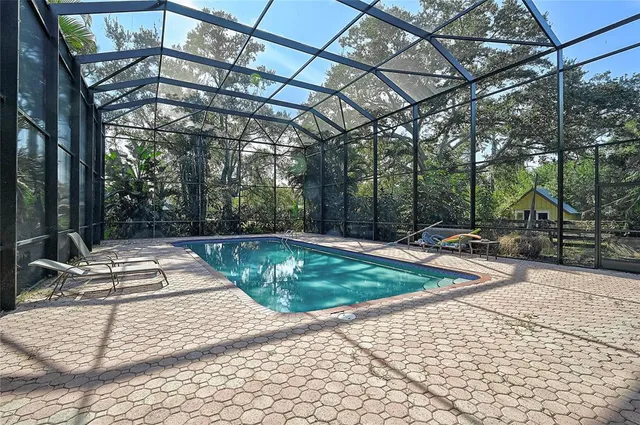 a view of a swimming pool with a patio