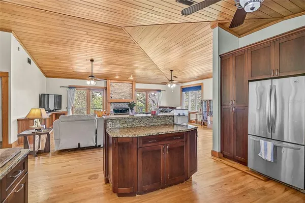 a kitchen with a stove and a refrigerator