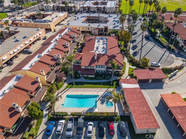 an aerial view of a houses with yard