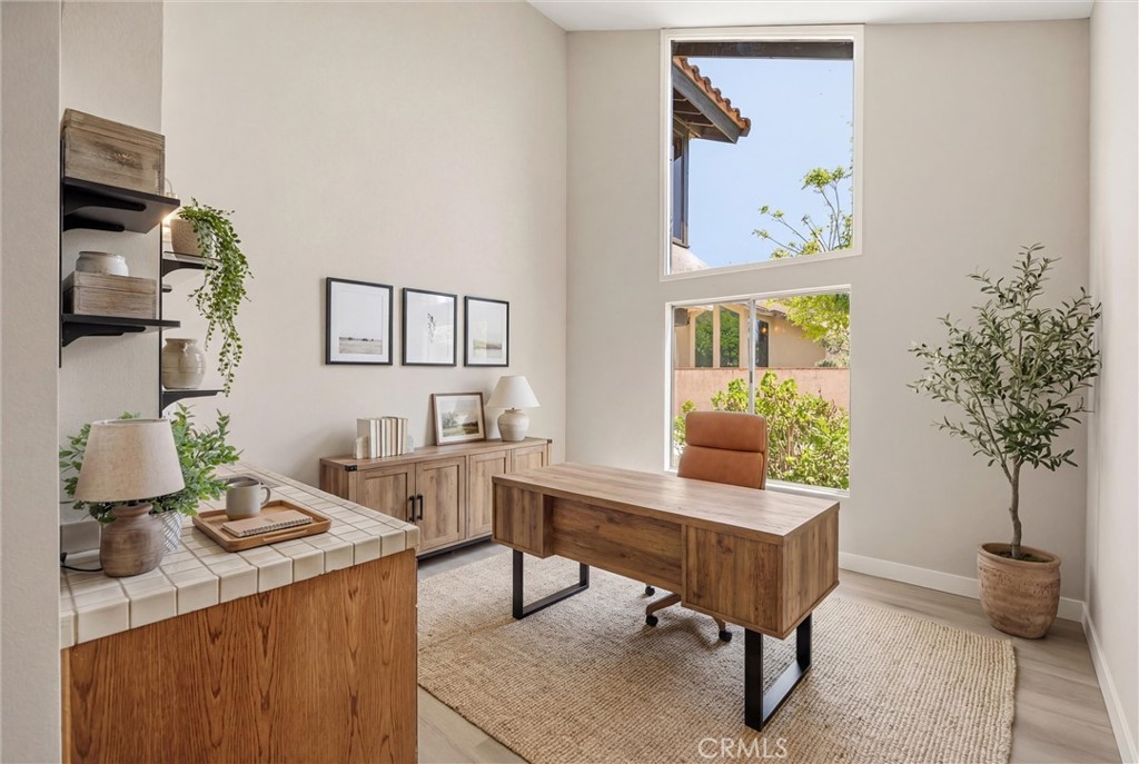 5895 Jadeite Avenue Rancho Cucamonga, CA 91737 - Photo 11 of 71 a view of a workspace with furniture and a potted plant