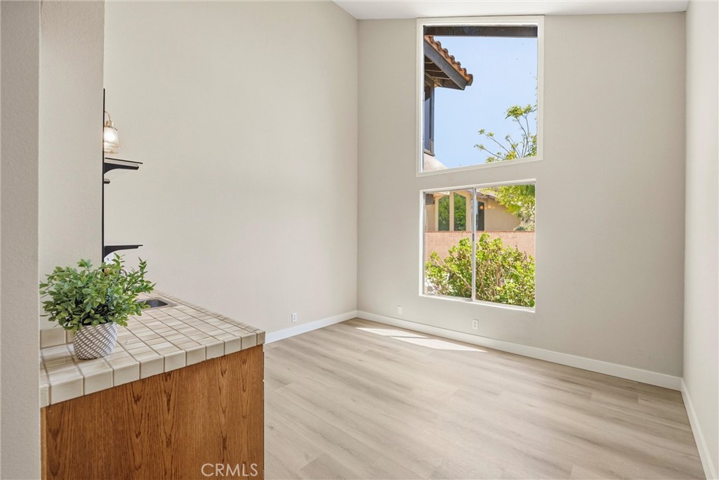 5895 Jadeite Avenue Rancho Cucamonga, CA 91737 - Photo 12 of 71 a view of an entryway with wooden floor