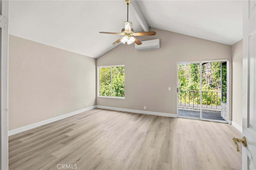 5895 Jadeite Avenue Rancho Cucamonga, CA 91737 - Photo 30 of 71 an empty room with wooden floor fan and windows