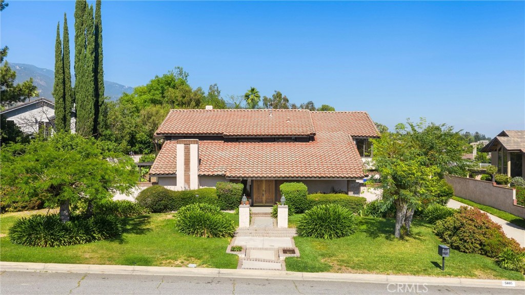 5895 Jadeite Avenue Rancho Cucamonga, CA 91737 - Photo 3 of 71 an aerial view of a house with a yard and potted plants